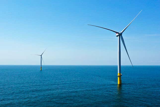 FILE - Two of the offshore wind turbines stand off the coast of Virginia Beach, Va., Monday, June 29, 2020. The company Siemens Gamesa said Friday Nov. 10, 2023, that it canceled plans to build blades for offshore wind turbines in coastal Virginia. It was the latest sign of struggle within the U.S.&#39;s nascent offshore wind industry. (AP Photo/Steve Helber, File)