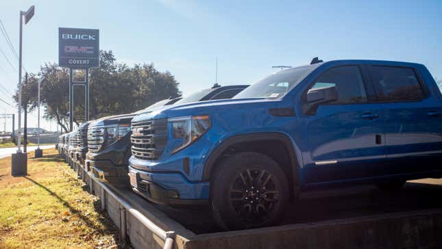 GMC pickup trucks are displayed for sale on a lot at a General Motors dealership on January 05, 2023 in Austin, Texas.