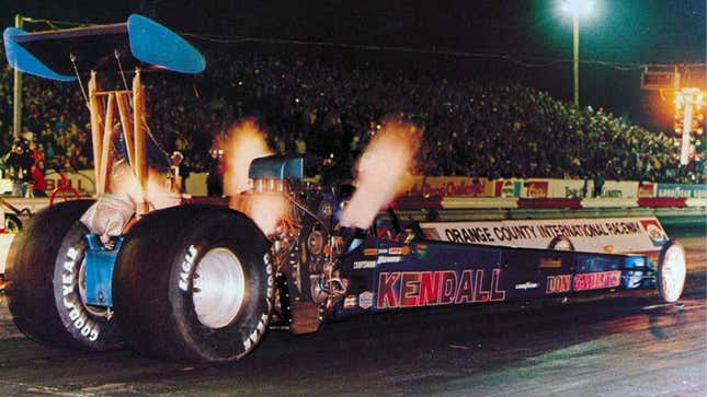 A photo of a sidewinder drag racer spitting flames. 