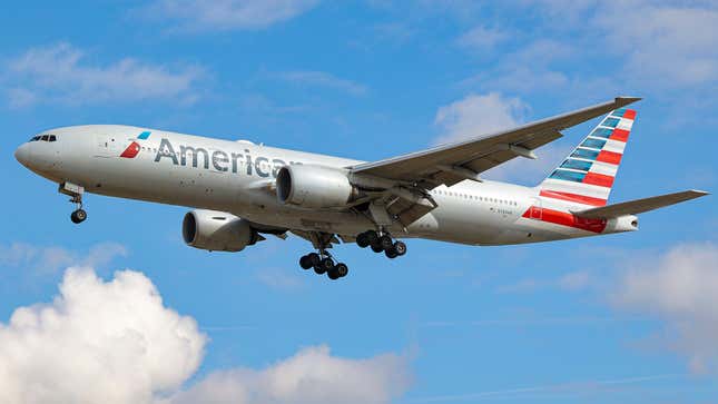 American Airlines Boeing 777 aircraft as seen on final approach flying over the houses of Myrtle avenue in London, a famous location for plane spotting, for landing at London Heathrow Airport LHR. The wide-body airliner B772 a Boeing 777-200 passenger airplane has the registration N784AN and is powered by 2x RR jet engines.American Airlines is the largest airline in the world by fleet size and passengers carried. The US carrier is based with HQ in Fort Worth Texas and member of Oneworld aviation alliance group.