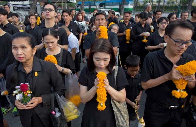 Thai mourners in front of a portrait of the late king outside the Grand Palace in October.