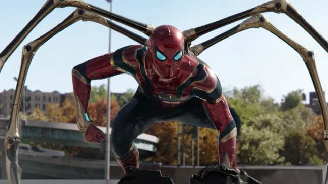 Spider-Man, in his multi-armed red and gold Iron Spider suit, crouches in readiness on a freeway.