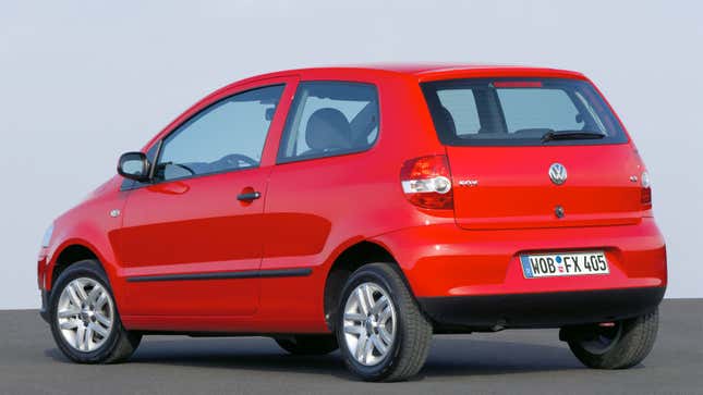 A photo of a red VW Fox city car. 