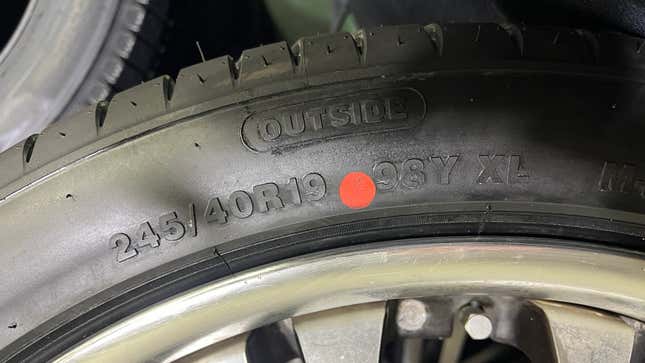 A tire with a red dot