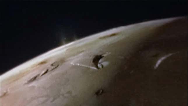 Plumes spewing from the surface of Io.