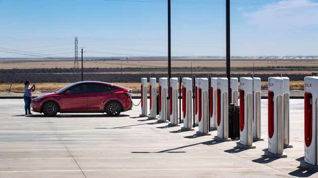 A deserted array of Tesla charging stations is viewed at 9 a.m. on June 19, 2024 in Kettleman City, California.
