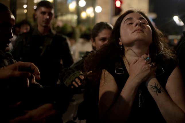 Israeli Border Police scuffle with a supporter of Israeli-American hostage Hersh Goldberg-Polin, who was kidnapped on Oct. 7, 2023, during a protest near Israeli Prime Minister Benjamin Netanyahu&#39;s official residence to demand a deal for the immediate release of all hostages, after Hamas released a video of Goldberg-Polin, in Jerusalem, Wednesday, April 24, 2024. (AP Photo/Maya Alleruzzo)