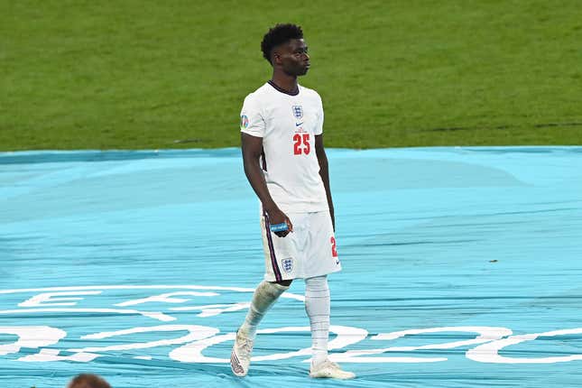 Bukayo Saka of England looks dejected after receiving his runners up medal following defeat in the UEFA Euro 2020 Championship Final between Italy and England at Wembley Stadium on July 11, 2021 in London, England. 