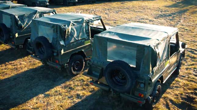 A row of Peugeot P4 military trucks rear 3/4 view