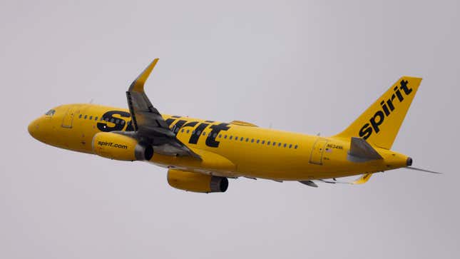 A photo of a yellow Spirit Airlines plane. 