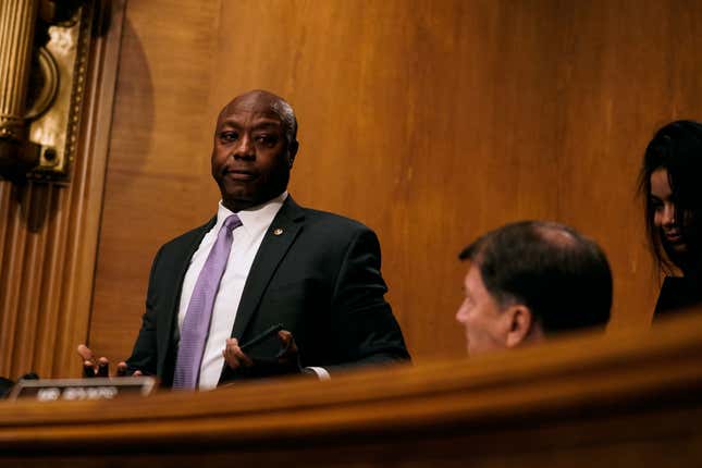 Senator Tim Scott (R-SC) gestures to Senator Mike Rounds (R-SD) while leaving after questioning U.S. Treasury Secretary Janet Yellen at a Senate Banking, Housing, and Urban Affairs Committee hearing on the Financial Stability Oversight Council Annual Report to Congress on May 10, 2022, on Capitol Hill in Washington, D.C.