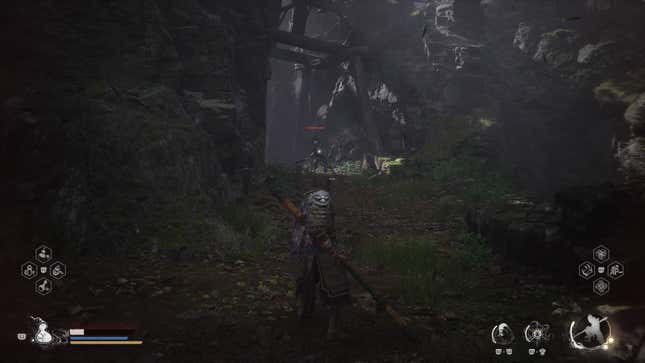 The player character stands in a shadowy canyon looking toward an enemy.