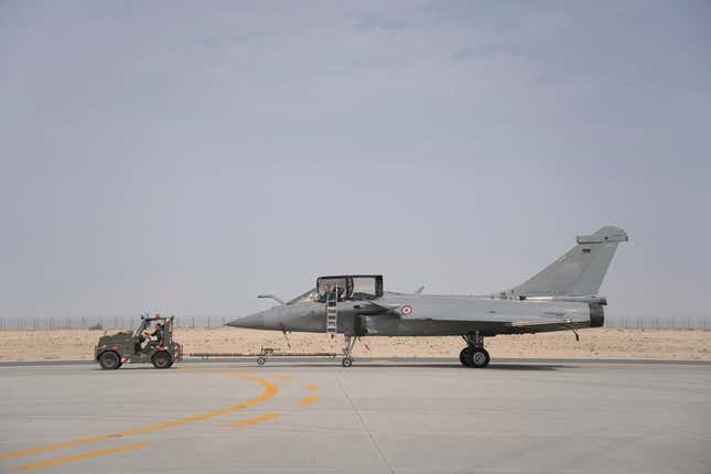 A French Dassault Rafale fighter jet is pulled out by a tug at the Dubai Air Show in Dubai, United Arab Emirates, Thursday, Nov. 16, 2023. (AP Photo/Jon Gambrell)