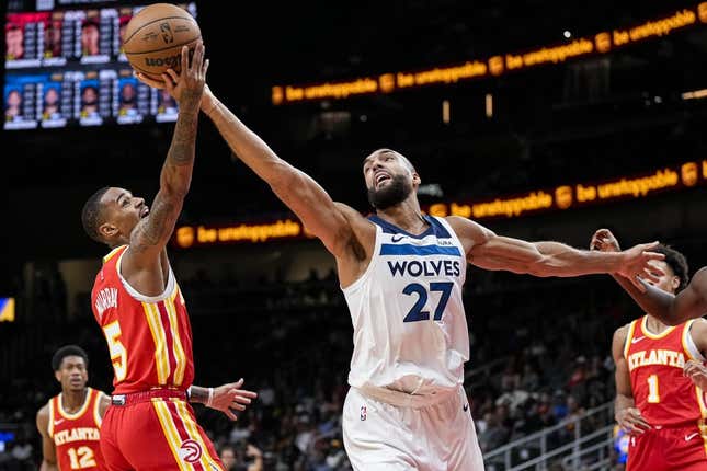 Oct 30, 2023; Atlanta, Georgia, USA; Minnesota Timberwolves center Rudy Gobert (27) and Atlanta Hawks guard Dejounte Murray (5) fight for a rebound during the first half at State Farm Arena.