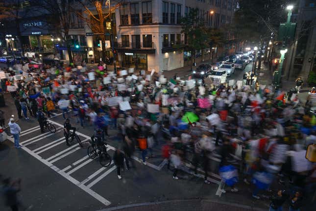 Hundreds of people carrying banners and flags, gather to protest against US President Trump’s immigration policies and march for freedom to defend immigrant families in Charlotte, North Carolina, United States on February 1, 2025.