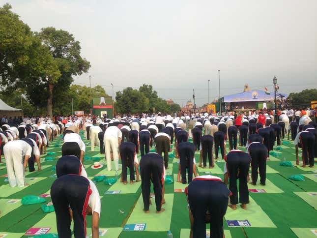 Participants perform yoga asanas at the International Yoga Day celebrations in New Delhi.