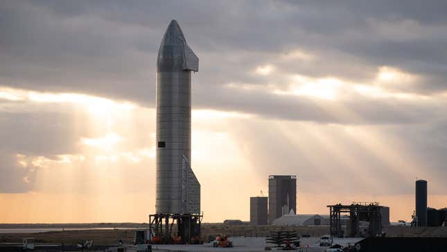 A photo of a Space X Starship rocket on the launch pad. 