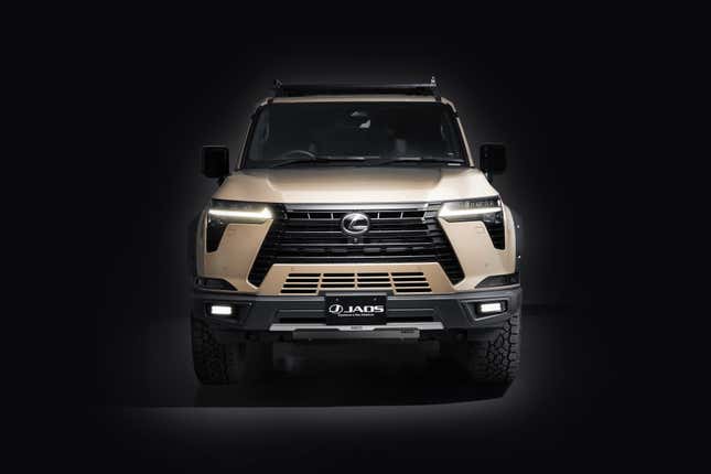 Front view of a modified beige Lexus GX on a black background