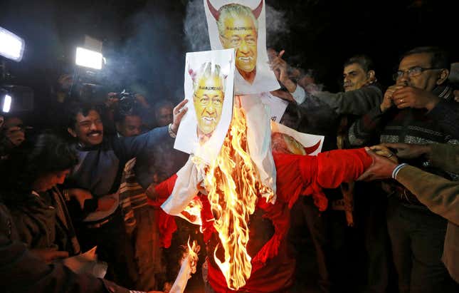 Protesters burning an effigy of Vijayan in New Delhi on Jan. 03.