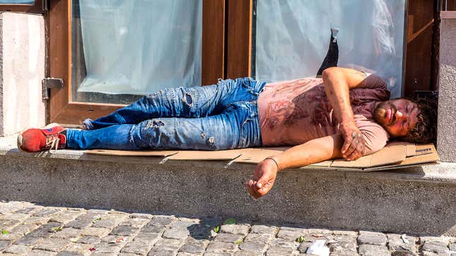 Image for article titled Man Sleeping On Sidewalk Must Not Know About Heat Advisory