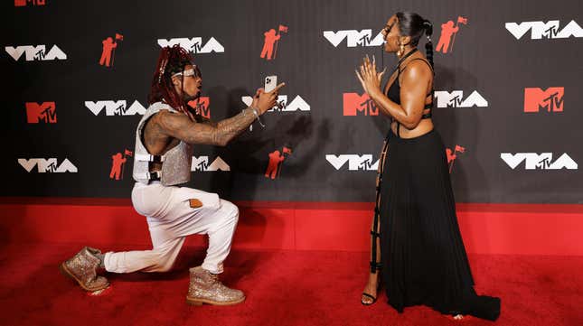 Nick Cannon and Ashanti on the 2021 MTV VMAs red carpet.