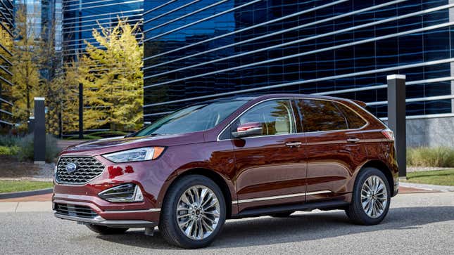 A photo of a burgundy Ford Edge SUV. 