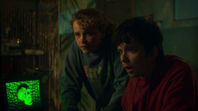 Two Choose or Die characters stare at a green, glowing computer screen with shocked looks on their faces.