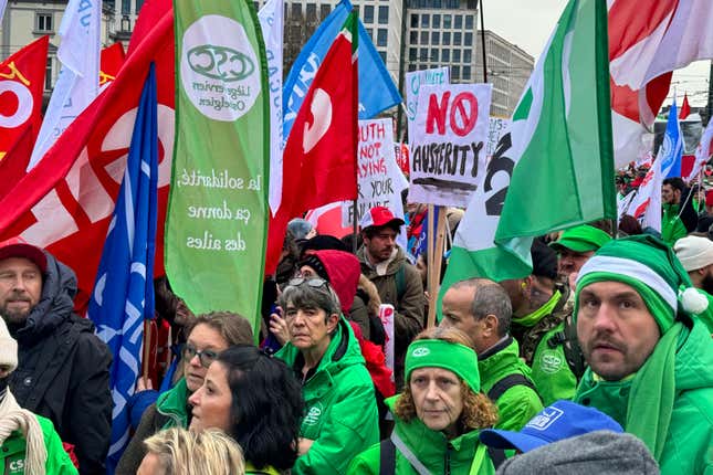 Protestors hold flags and gather during a demonstration against austerity measures in Brussels, Tuesday, Dec. 12, 2023. Thousands of protesters gathered in Brussels on Tuesday to protest what they perceive as new austerity measures as the 27 European Union countries discuss ways to overhaul rules on government spending. (AP Photo/Sylvain Plazy)