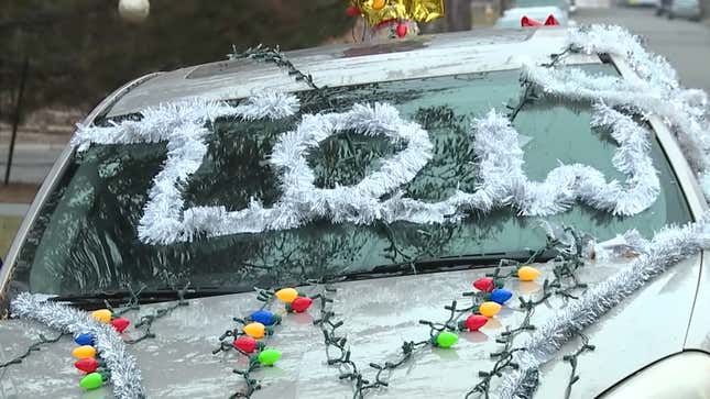 Image for article titled Neighborhood Gets Into The Holiday Spirit By Decorating An Abandoned Car