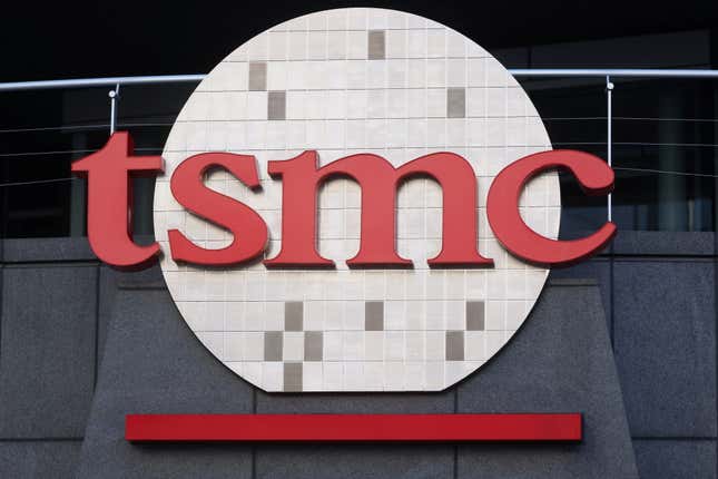 close up of TSMC logo on grey building