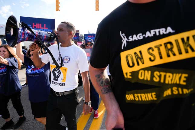 Actor Hill Harper, a democrat running for Michigan&#39;s open U.S. Senate seat, walks with SAG-AFTRA members in the Labor Day parade in Detroit, Monday, Sept. 4, 2023. (AP Photo/Paul Sancya)