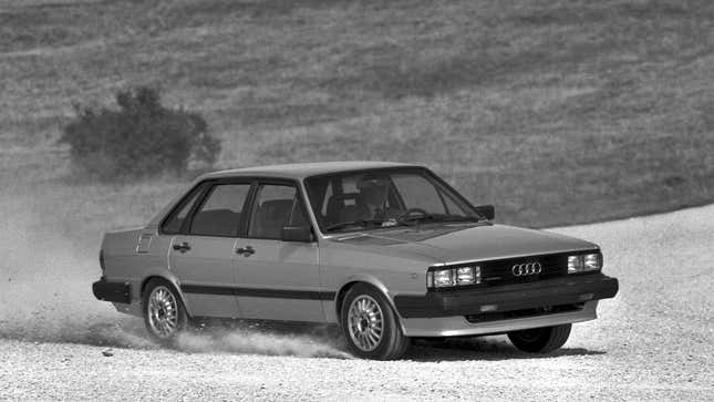 A black and white photo of an Audi 4000 Quattro sedan. 