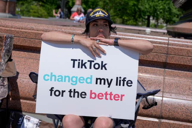 A TikTok content creator, sits outside the U.S. Capitol, Tuesday, April 23, 2024, in Washington as Senators prepare to consider legislation that would force TikTok&#39;s China-based parent company to sell the social media platform under the threat of a ban, a contentious move by U.S. lawmakers. (AP Photo/Mariam Zuhaib)