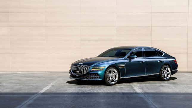 A photo of a teal Genesis G80 sedan. 