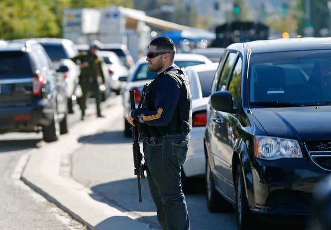 Police officers secure the area