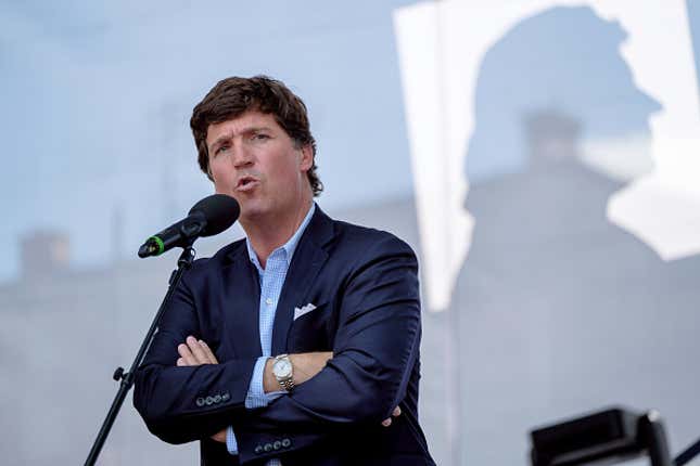 ESZTERGOM, HUNGARY - AUGUST 07: Tucker Carlson speaks during the Mathias Corvinus Collegium (MCC) Feszt on August 7, 2021 in Esztergom, Hungary. The multiday political event was organized by the Mathias Corvinus Collegium (MCC), a privately managed foundation that recently received more than $1.7 billion in government money and assets. The leader of its main board, Balazs Orban, who is also a state secretary in the prime minister’s office, said MCC’s priority is promoting “patriotism” among the next generation of Hungary’s leaders. 
