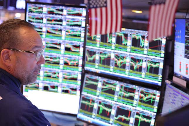  Traders work on the floor of the New York Stock Exchange on Oct. 8.