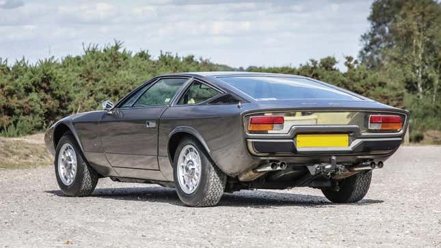 Rear 3/4 view of a grey Maserati Khamsin