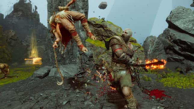 Kratos attacks an enemy in the air.