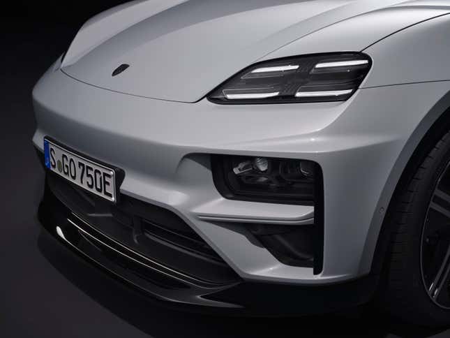 Detail shot of the front end and headlights of a white 2024 Porsche Macan EV