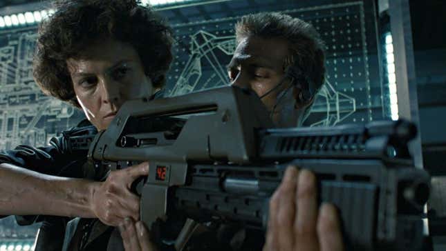  Sigourney Weaver's Ripley holds a pulse rifle in Aliens while Michael Biehn's Hicks attempts to school her.