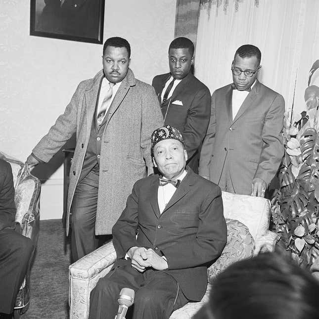 Bodyguards Herbert Muhammad, son of Elijah Muhammad; John Ali and James Shabazz, assistant minister Mosque #2 (l to r) surround Nation of Islam leader Elijah Muhammad at a news conference where the religious leader denied any connection to the assassination