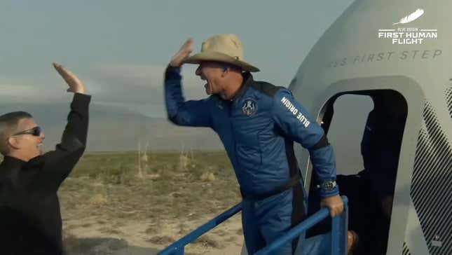 Jeff Bezos giving a high five after landing his New Shepherd mission.