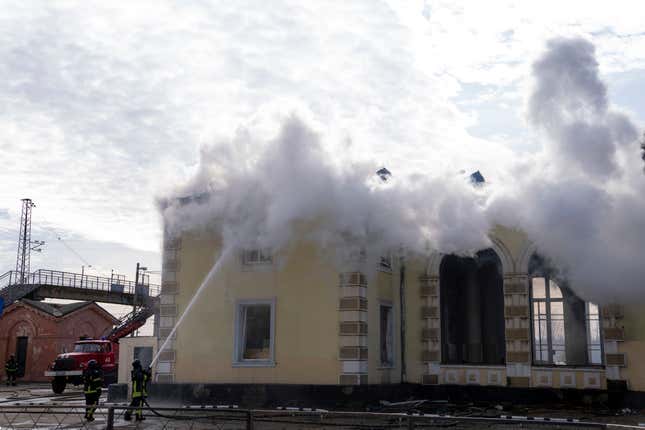 Firefighters put out the fire a railway station after Russians hit in Kostiantynivka, Donetsk region, Ukraine, Sunday, Feb. 25, 2024. A woman was wounded and a railway station, shops and residential houses were badly damaged amid heavy bombing. (AP Photo/Alex Babenko)