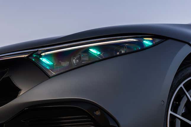 Turquoise marker lights on a Mercedes-Benz EQS headlight