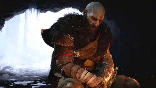 Kratos sits in a cave sad. 