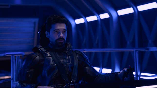 James Holden pilots the Rocinante in a blue-tinged shot from The Expanse.