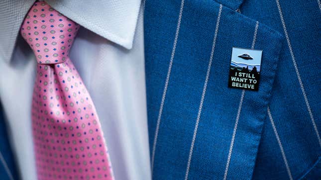 An audience member wears a UFO pin during a House Oversight and Accountability subcommittee hearing on UFOs, Wednesday, July 26, 2023, on Capitol Hill in Washington. 