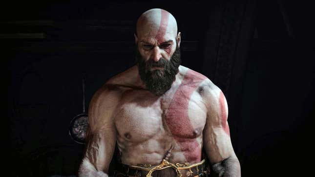 Kratos stands in a dark room.