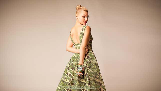 Person in camouflage wedding dress holding a can of Busch beer